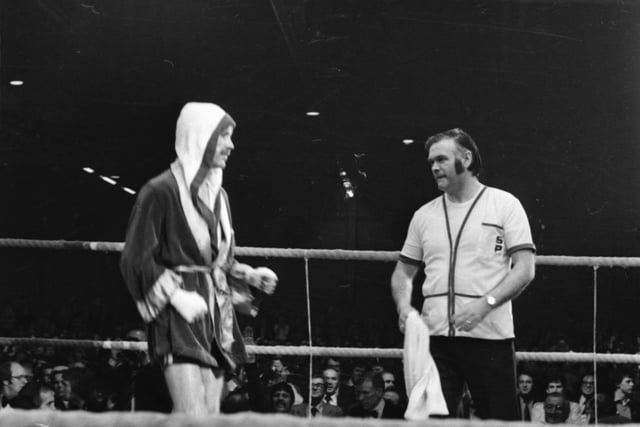 Charlie gets some last minute advice from trainer Tommy Donnelly.