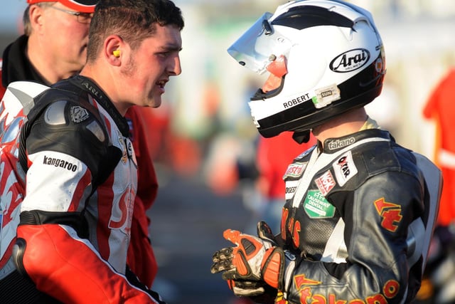 Michael Dunlop chats to his father Robert on the grid at the ill-fated North West 200 in 2008.