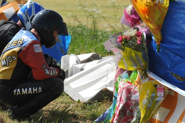 Bikers at the scene of Robert Dunlop's fatal accident at Mather's Cross at the 2008 North West 200.