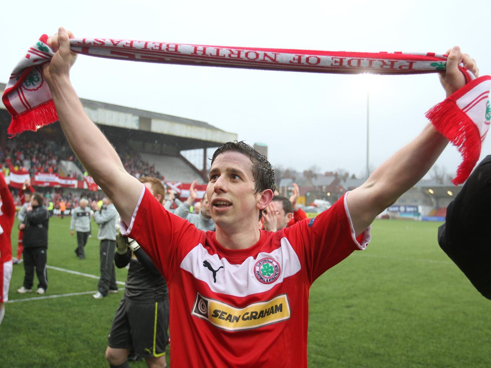 Cliftonville's Eamonn Seydak celebrates winning the Premiership in 2013.