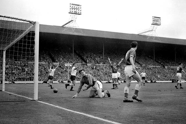 Tottenham Hotspur players show jubilation after Cliff Jones has put the ball in the Leicester City net, the goal was disallowed for offside