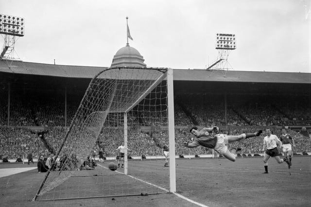 Gordon Banks can only watch as the ball enters the net for Tottenham Hotspur's second goal. Set up by Bobby Smith (by post) and scored by Terry Dyson (not pictured).