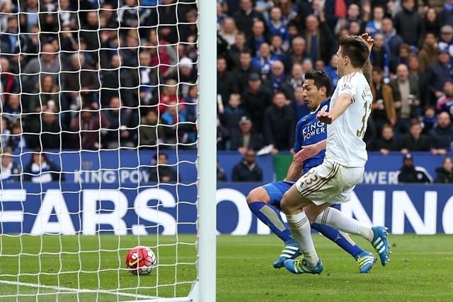 Leonardo Ulloa (left) scores his sides third goal of the match in the 4-0 win over Swansea