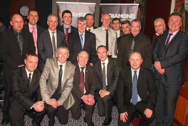 Members of the Derry City treble winning team alongside manager Jim McLaughlin and the then Ireland boss Martin O'Neill, during the club's recent celebrations of the historic achievement, which still to this day has yet to be equalled.