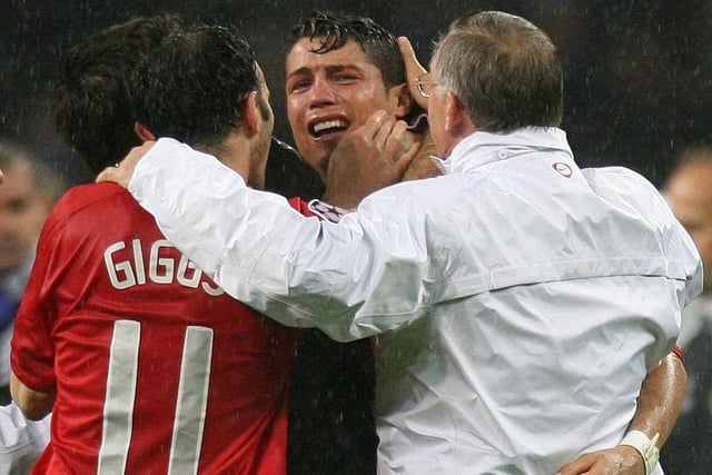 Manchester United's Cristiano Ronaldo is emotional as he celebrates with manager Alex Ferguson and Ryan Giggs