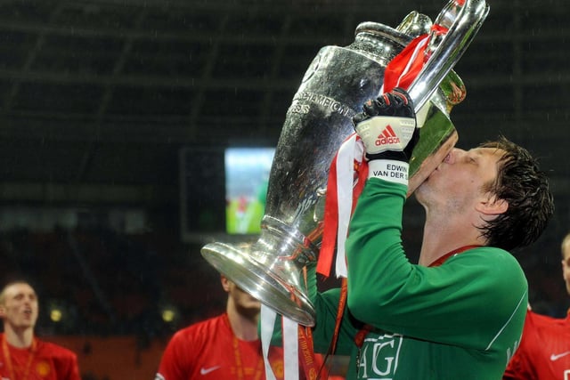 Manchester United's Edwin Van Der Sar celebrates with the trophy