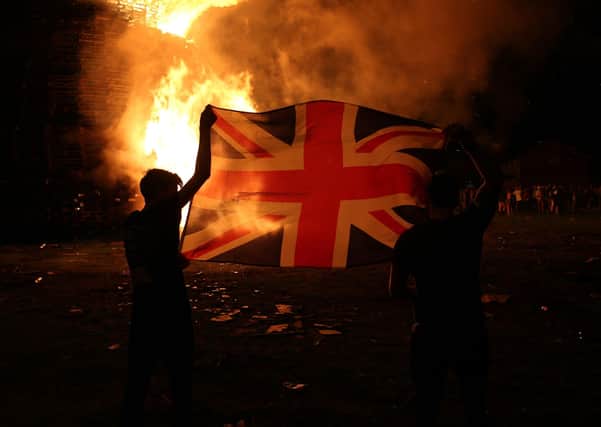 The huge bonfire  in the Shankill Road in Belfast  is lit on the "Eleventh night" to usher in the Twelfth commemorations