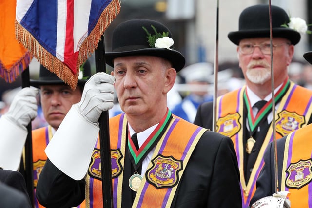 12/7/11 Mandatory Credit Darren Kidd/Presseye.com   Orangemen take part in Twelfth of July parades as they make their way to the field at Shaws Bridge, Belfast.  The County Grand Lodge Colour Party lead of the parade