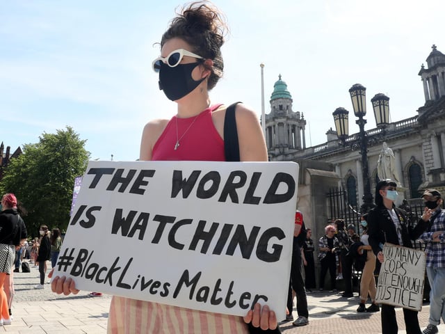 'The world is watching' was just one of the banners at the Black Lives Matter solidarity rally in Belfast on Monday afternoon.