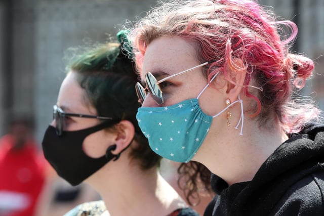 Protesters adhered to social distancing measures and wore face masks to reduce the risk of spreading COVID-19.