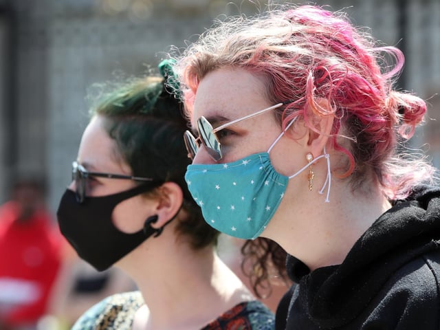 Protesters adhered to social distancing measures and wore face masks to reduce the risk of spreading COVID-19.