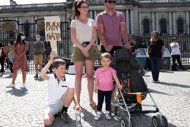 A young family pictured at the rally outside of Belfast City Hall.