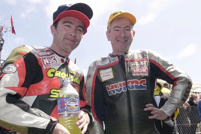 Joey Dunlop and his brother Robert at the Isle of Man TT in 2000 after they finished first and second respectively in the Ultra-Lightweight race.