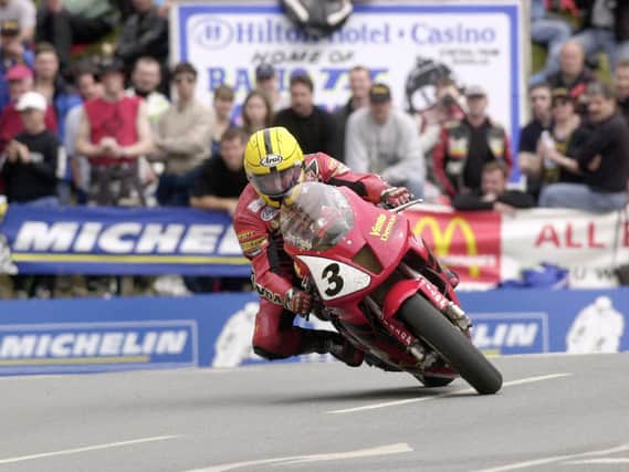 Joey Dunlop in action in the Formula One race at the 2000 Isle of Man TT.
