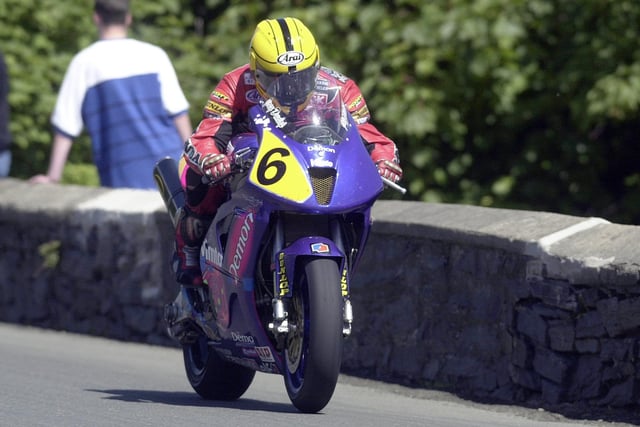 Northern Ireland legend Joey Dunlop at Sulby Bridge in the Senior TT in 2000. Joey finished on the rostrum in third place behind David Jefferies and Michael Rutter in his last ever race around the Mountain Course.