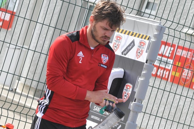 Derry City defender, Colm Horgan gets himself ready for training after using the sanitising station at Aileach.