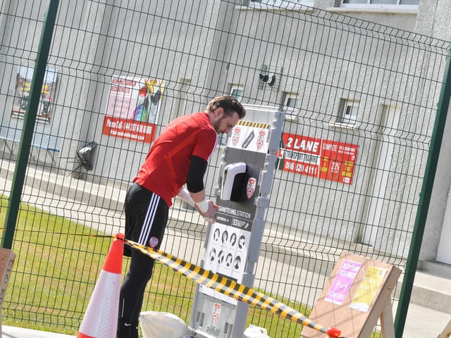 Derry City keeper, Peter Cherrie pictured washing his hands prior to the club's first training session.