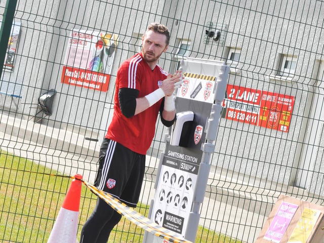 Peter Cherrie uses hand sanitizer before a Derry City training session in Inishowen.