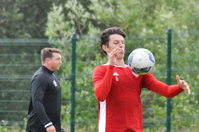 Derry City defender, Eoin Toal shows close control as he chests this ball down during the club's first training session at Aileach FC as assistant manager, Kevin Deery watches on.