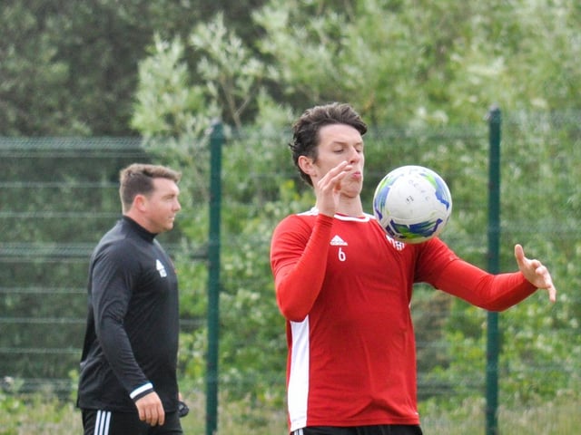 Derry City defender, Eoin Toal shows close control as he chests this ball down during the club's first training session at Aileach FC as assistant manager, Kevin Deery watches on.