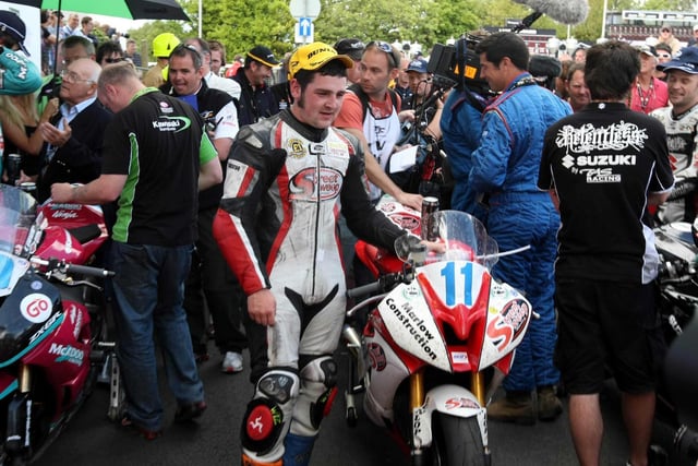 A young Michael Dunlop poses for photographs after winning his first TT - nine years on from his uncle Joey's final hat-trick in 2000.