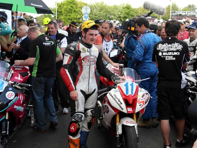 A young Michael Dunlop poses for photographs after winning his first TT - nine years on from his uncle Joey's final hat-trick in 2000.