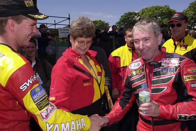 Senior TT winner David Jefferies and Joey Dunlop, who finished third, shake hands after the race in 2000.