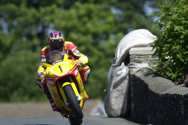 Yorkshireman David Jefferies at Sulby Bridge on the V&M Yamaha on his way to winning the Senior TT to compete a hat-trick in 2000.