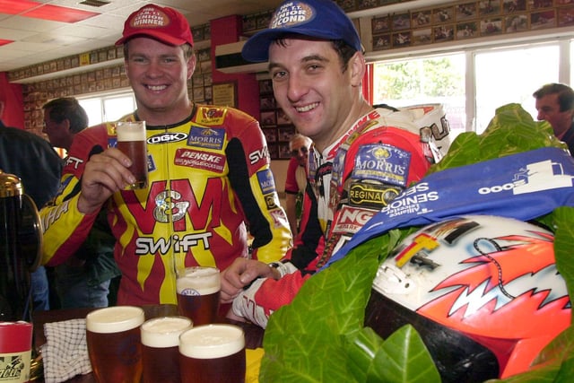David Jefferies and Michael Rutter celebrate with a pint after finishing first and second respectively in the 2000 Senior TT.