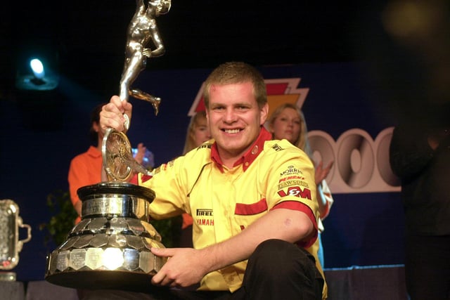 Englishman David Jefferies with the Senior TT trophy at the prize-giving ceremony in Douglas on the Isle of Man in 2000. Jefferies was tragically killed during TT practice in 2003.