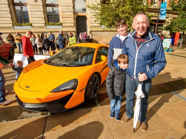 Joe Whoriskey with Emmet and Alex during Super Car Sunday in aid of the Mayorâ€TMs Charity Appeal for Foyle Down Syndrome Trust. Picture Martin McKeown. 03.10.21