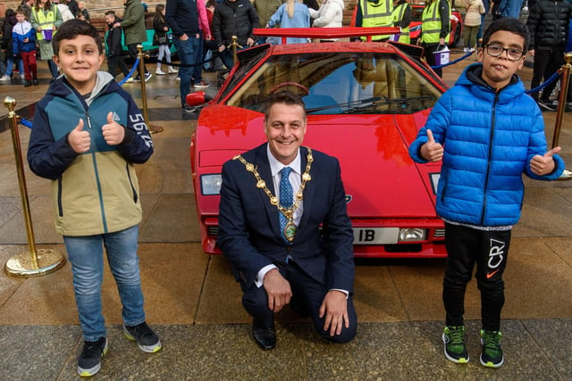 Sami Orakzai and Saim Bahli pictured with the Mayor Graham Warke during Super Car Sunday in aid of the Mayorâ€TMs Charity Appeal for Foyle Down Syndrome Trust. Picture Martin McKeown. 03.10.21