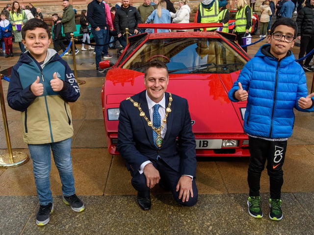 Sami Orakzai and Saim Bahli pictured with the Mayor Graham Warke during Super Car Sunday in aid of the Mayorâ€TMs Charity Appeal for Foyle Down Syndrome Trust. Picture Martin McKeown. 03.10.21