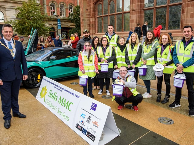 The Mayor Alderman Graham Warke and members of Foyle Down Syndrome Trust with Andy Allen from A+ Detailing, one of the sponsors, during Super Car Sunday in aid of the Mayorâ€TMs Charity Appeal for Foyle Down Syndrome Trust. Picture Martin McKeown. 03.10.21