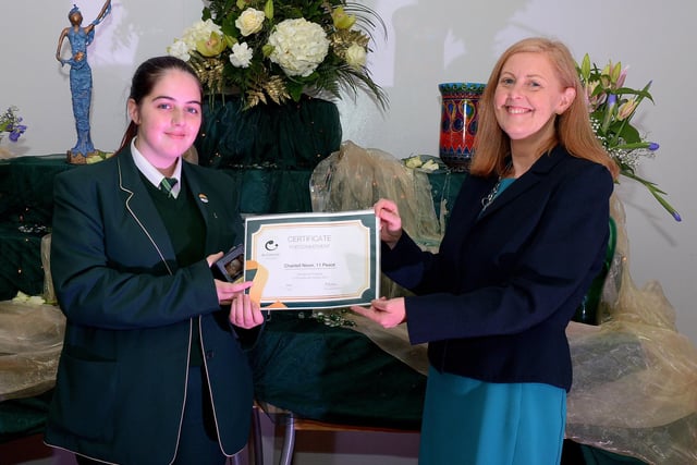 Chantell Nixon receives the Peace Commitment Award from Martine Mulhern, Principal of St Cecilia’s College, at the KS4 Awards presentation on Thursday afternoon last in the school. DER2141GS – 029