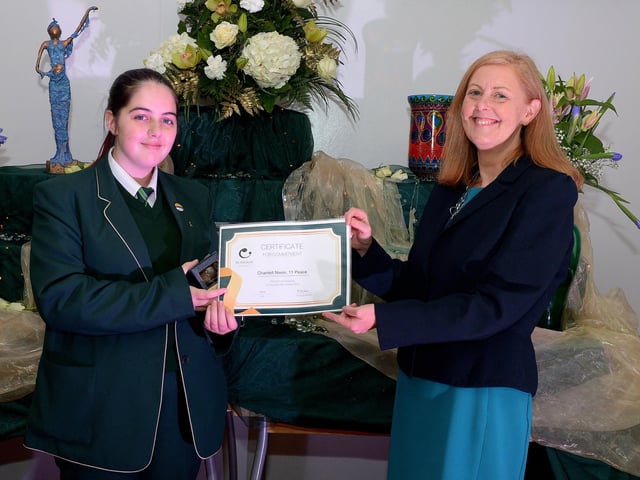 Chantell Nixon receives the Peace Commitment Award from Martine Mulhern, Principal of St Cecilia’s College, at the KS4 Awards presentation on Thursday afternoon last in the school. DER2141GS – 029
