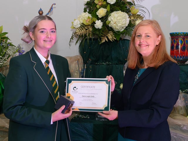 Demi-Leigh Duffy receives the GCSE Subject Award for Art & Textile from Martine Mulhern, Principal of St Cecilia’s College, at the KS4 Awards presentation on Thursday afternoon last in the school. DER2141GS – 034