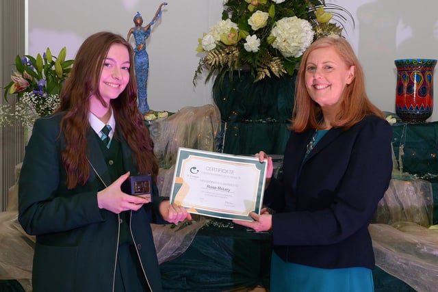 Rosie McLery receives a Top GCSE Award from Martine Mulhern, Principal of St Cecilia’s College, at the KS4 Awards presentation on Thursday afternoon last in the school. DER2141GS – 037