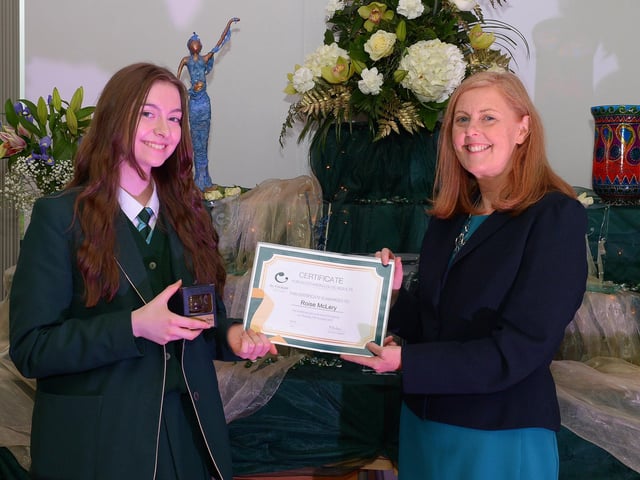 Rosie McLery receives a Top GCSE Award from Martine Mulhern, Principal of St Cecilia’s College, at the KS4 Awards presentation on Thursday afternoon last in the school. DER2141GS – 037