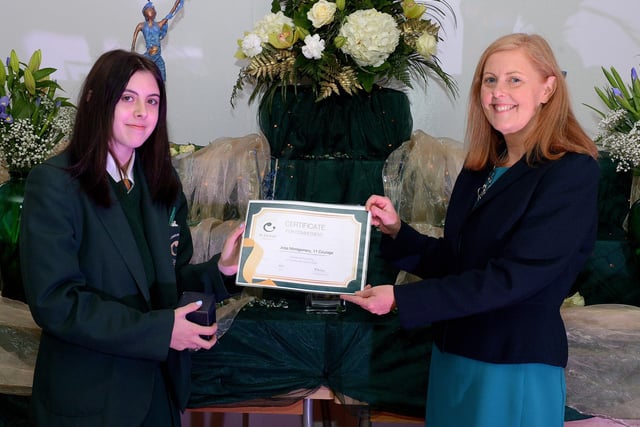 Jodi Montgomery receives the Courage Commitment Award from Martine Mulhern, Principal of St Cecilia’s College, at the KS4 Awards presentation on Thursday afternoon last in the school. DER2141GS – 030