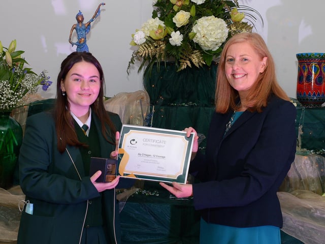 Aly O’Hagan receives the Courage Commitment Award from Martine Mulhern, Principal of St Cecilia’s College, at the KS4 Awards presentation on Thursday afternoon last in the school. DER2141GS – 033