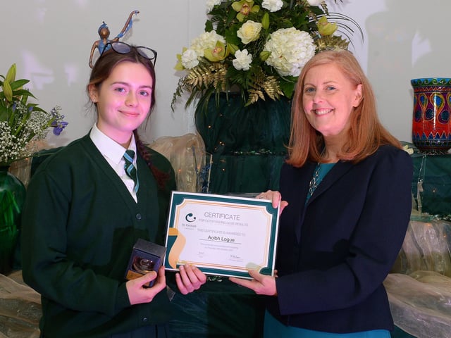 Aoibh Logue receives a Top GCSE Award from Martine Mulhern, Principal of St Cecilia’s College, at the KS4 Awards presentation on Thursday afternoon last in the school. DER2141GS – 038