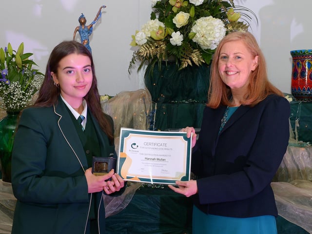 Hannah Mullan receives a Top GCSE Award from Martine Mulhern, Principal of St Cecilia’s College, at the KS4 Awards presentation on Thursday afternoon last in the school. DER2141GS – 039