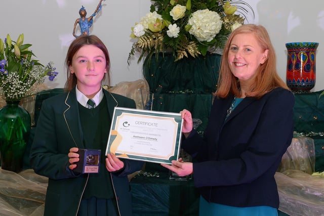 Aiobheann O’Doherty receives the GCSE Subject Award ICT, Science and Spanish from Martine Mulhern, Principal of St Cecilia’s College, at the KS4 Awards presentation on Thursday afternoon last in the school. DER2141GS – 036