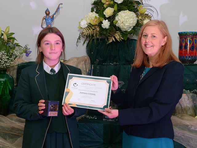 Aiobheann O’Doherty receives the GCSE Subject Award ICT, Science and Spanish from Martine Mulhern, Principal of St Cecilia’s College, at the KS4 Awards presentation on Thursday afternoon last in the school. DER2141GS – 036