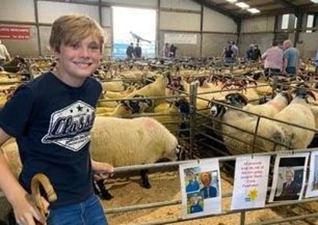 Zak is pictured at the Armoy Sheep Sale where he sold a ewe donated by his grandfather, Joe Dickson.