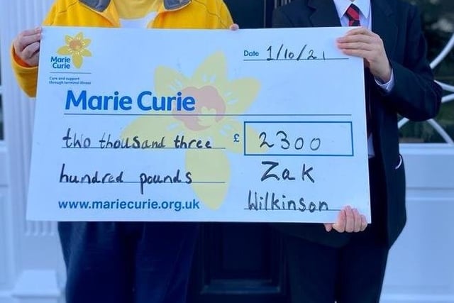 The 11-year-old was excited to hand over his cheque for £2,300 to Heather Miller from Marie Curie.