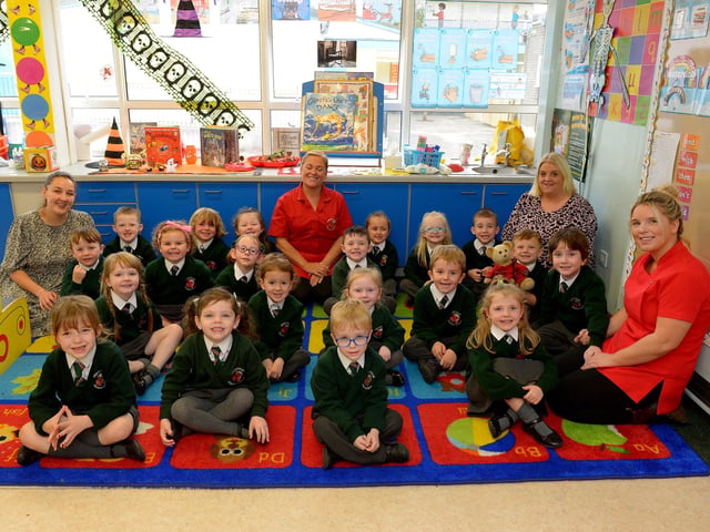 Miss Ramsay (on the left) teacher Miss Crossan, Miss Feeney and Miss Morrison, classroom assistants, pictured with their P 1 class at Greenhaw Primary School. DER2141GS – 019
