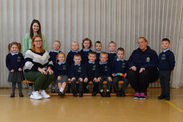 Mrs McMullan (seated on the left) teacher, Miss Gibson and Miss Holland, classroom assistants, pictured with their P1 class at Ashlea Primary School. DER2140GS – 027