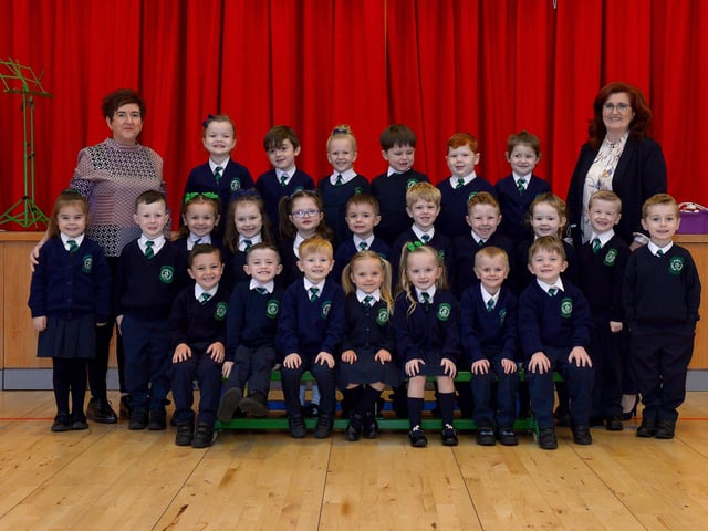 Mr Dooley (on the right) teacher and Mrs McCallion classroom assistant with their P1 class at St Patrick’s Primary School. DER2140GS – 019